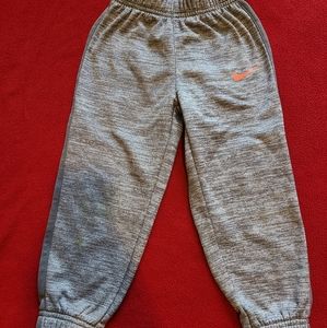 Nike kids size 4t heather grey with orange swoosh trackpants.